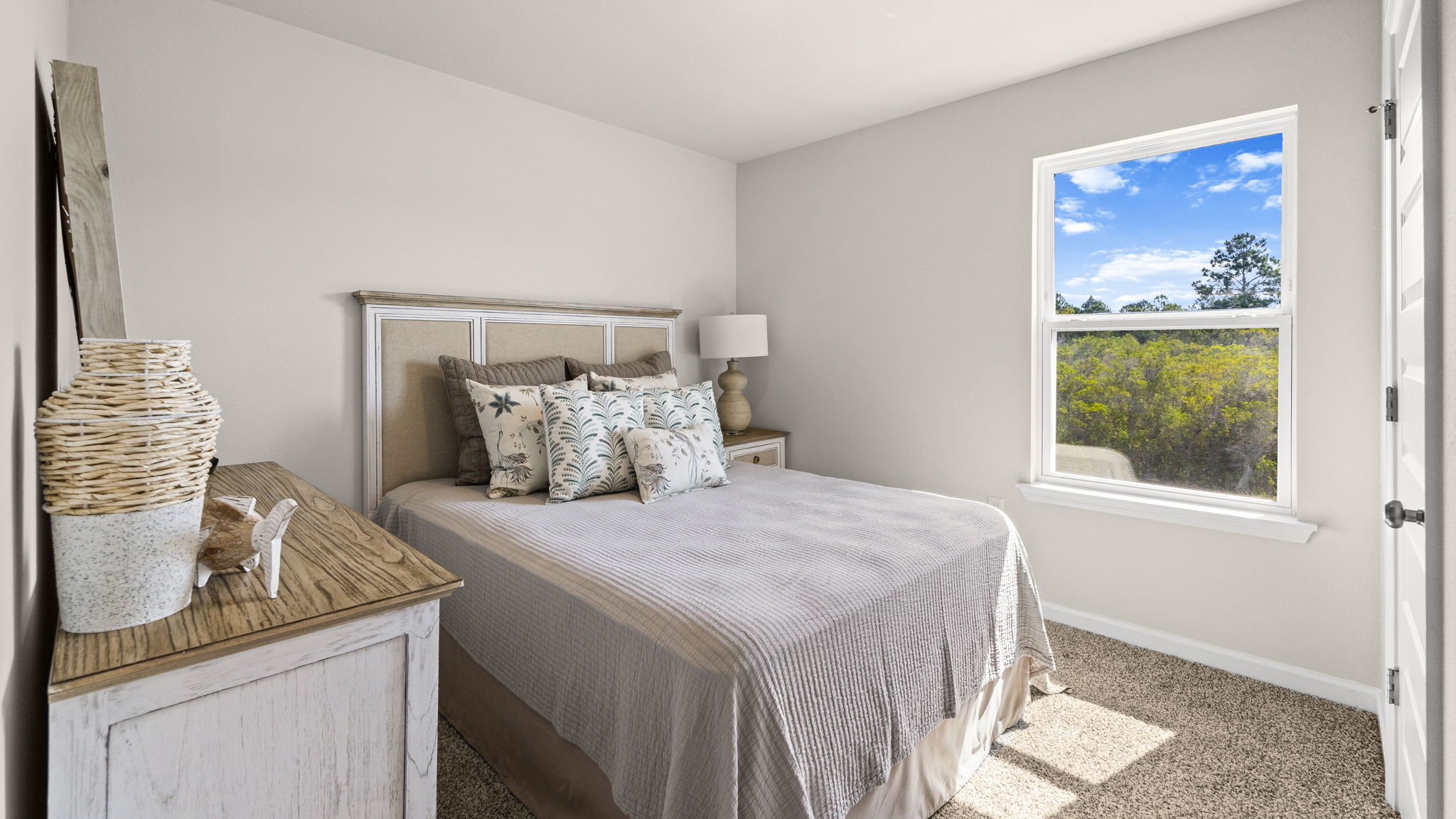 Bedroom with carpet floor and window.