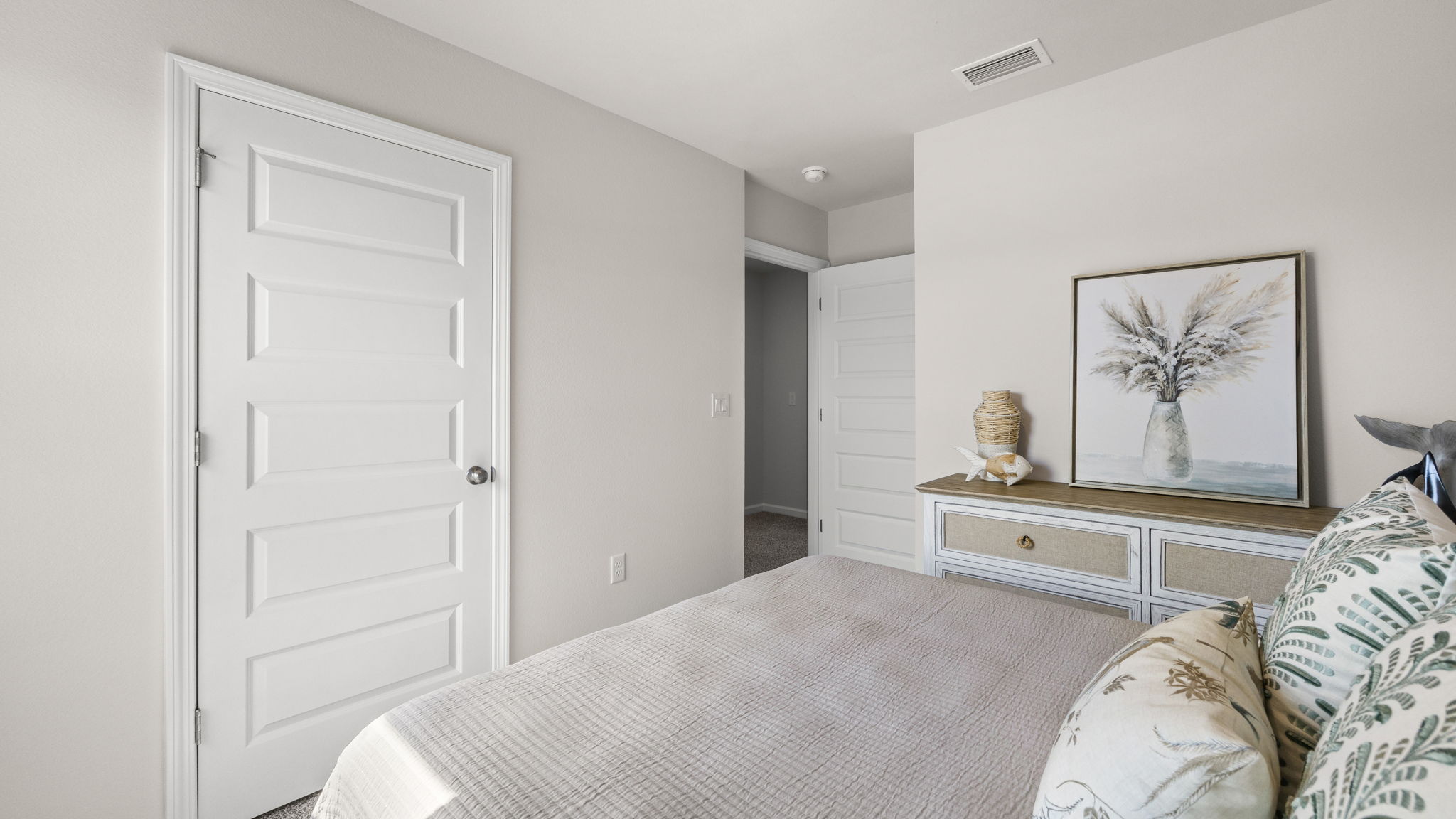 Bedroom with carpet floor and window.