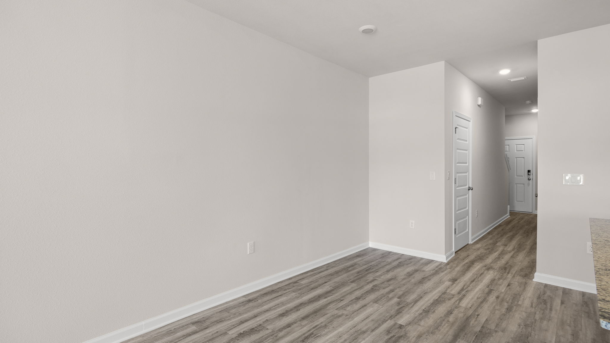 Dining area next to hallway.