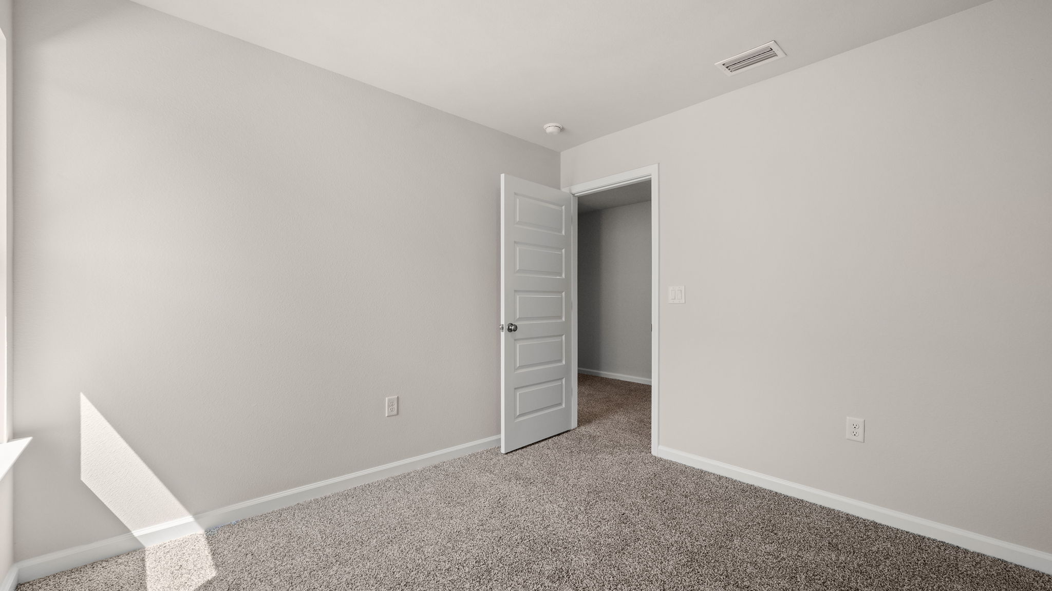 Bedroom with carpet floor.