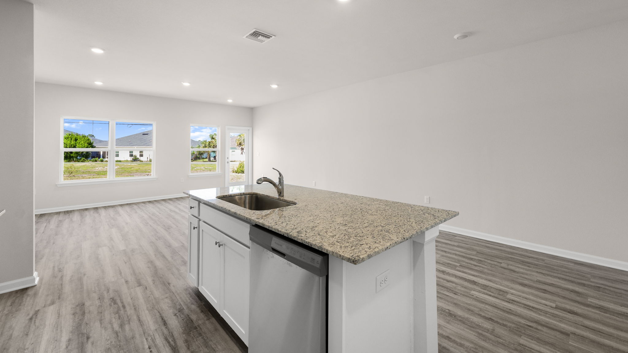 Kitchen with granite countertops and stainless-steel appliances.