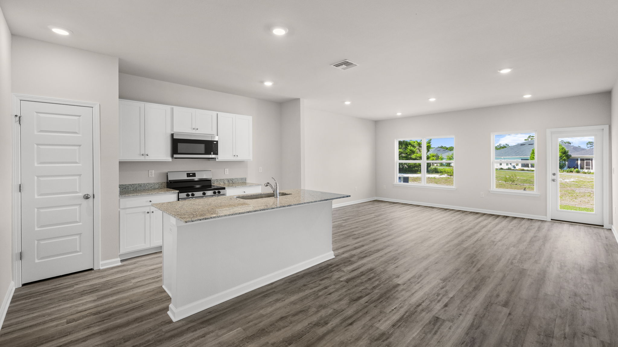 Open kitchen with island and living room.