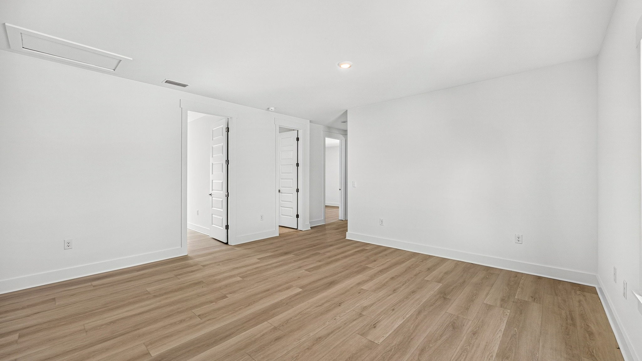Upstairs bonus area with EVP flooring next to bedrooms.