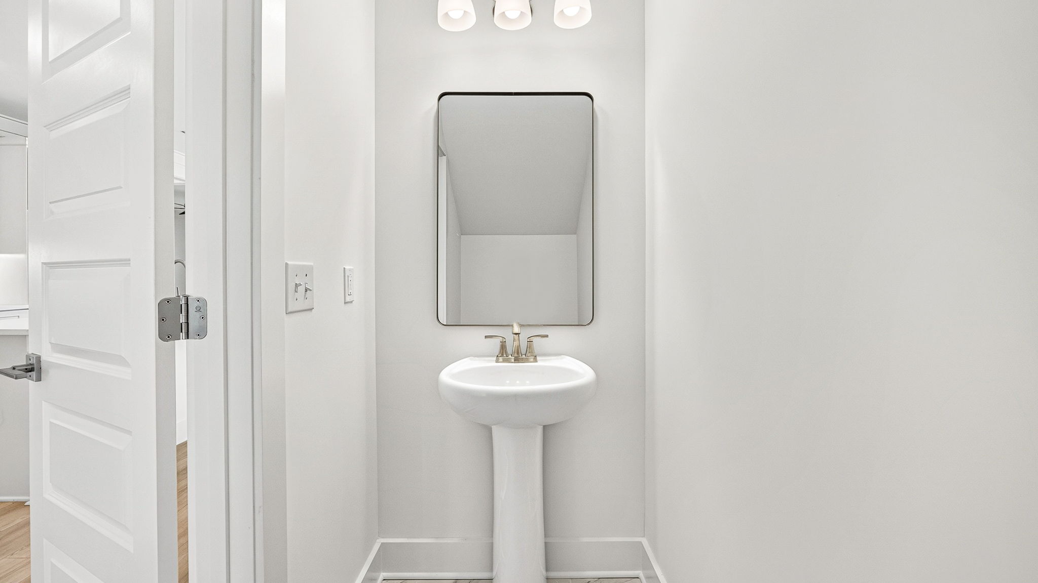 Half bathroom with single sink.
