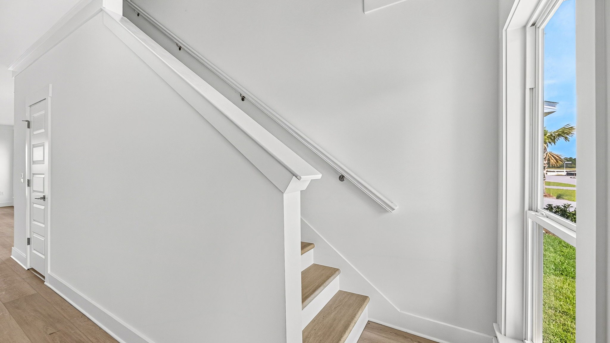 Staircase next to front door.