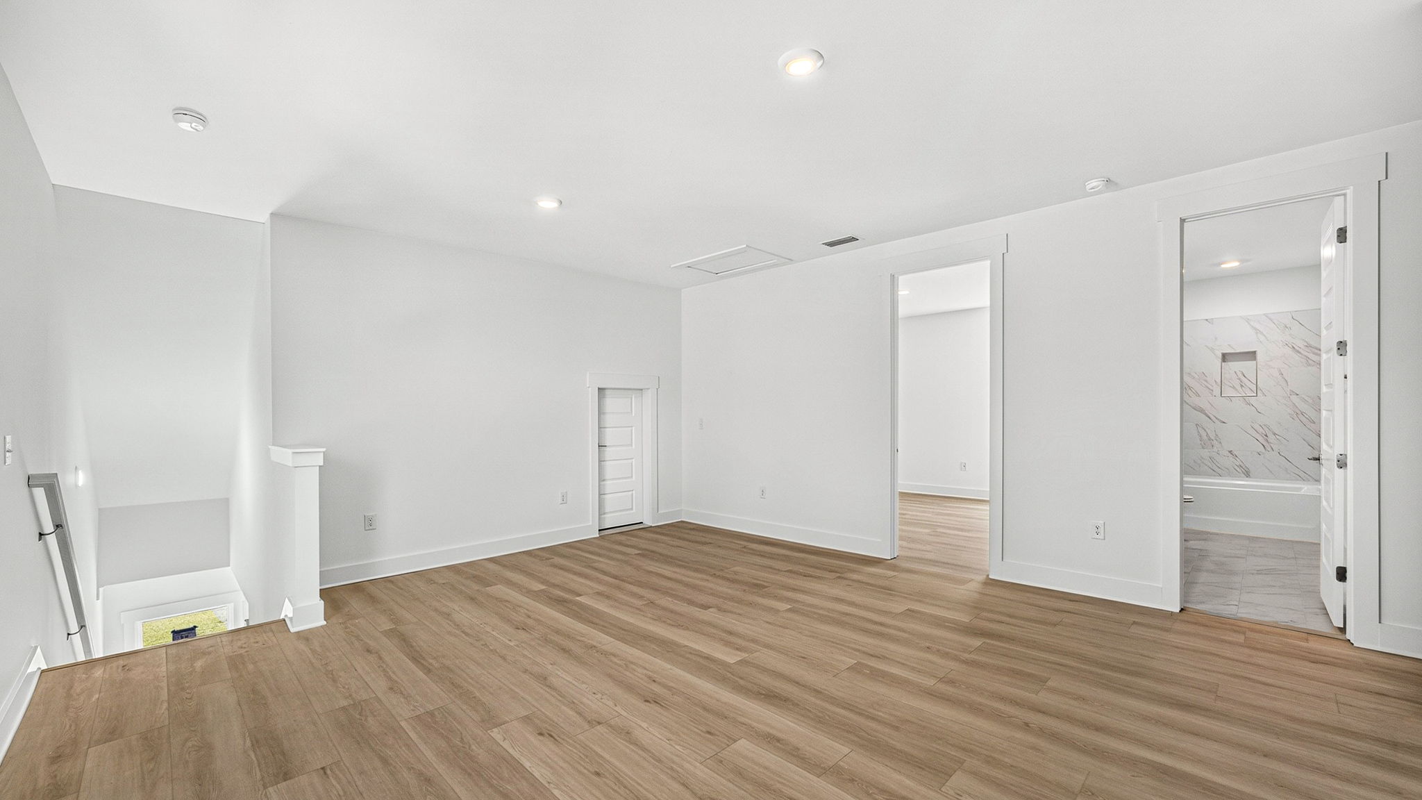 Upstairs bonus area with EVP flooring next to bedrooms.