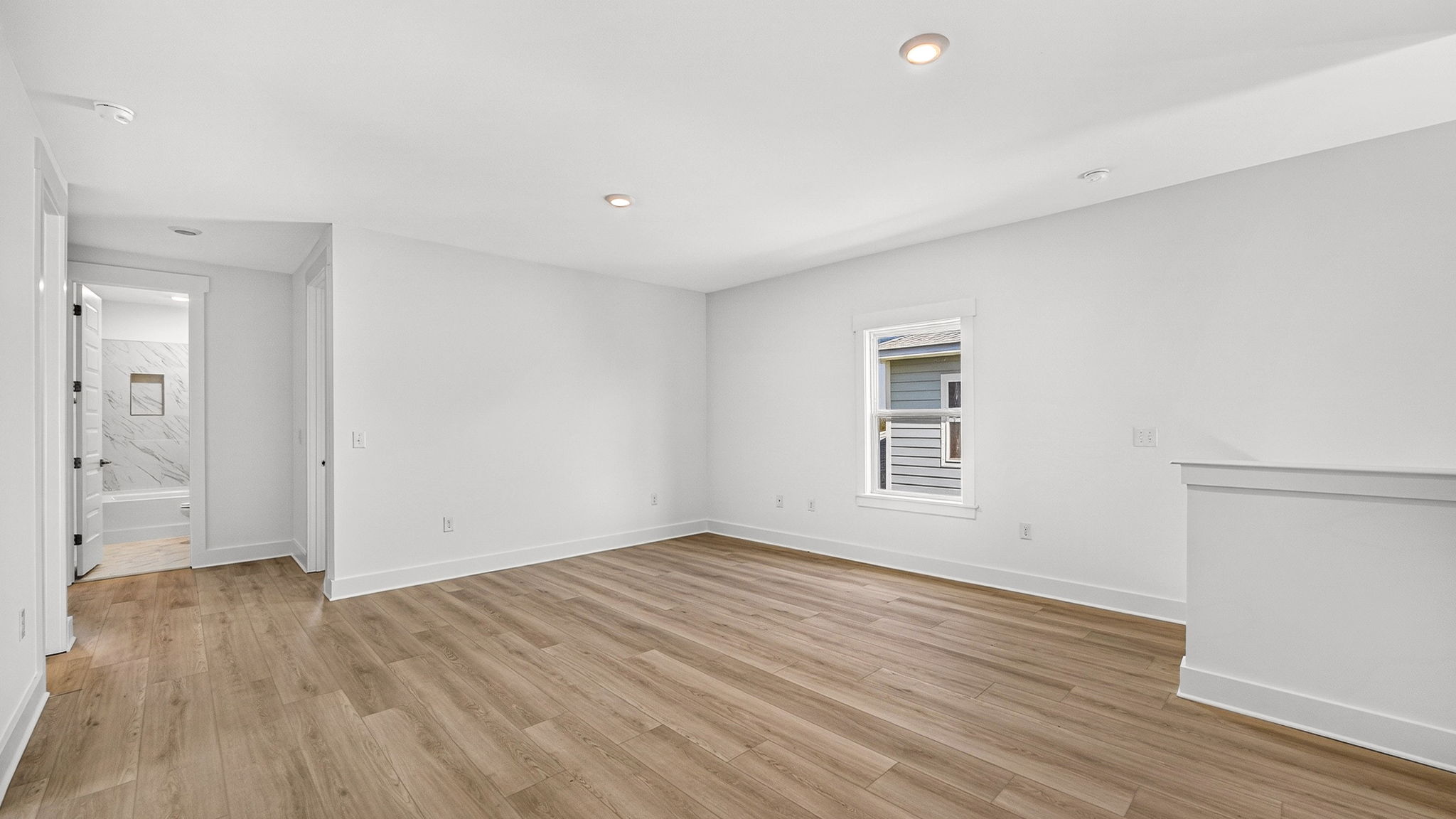 Upstairs bonus area with EVP flooring next to bedrooms.