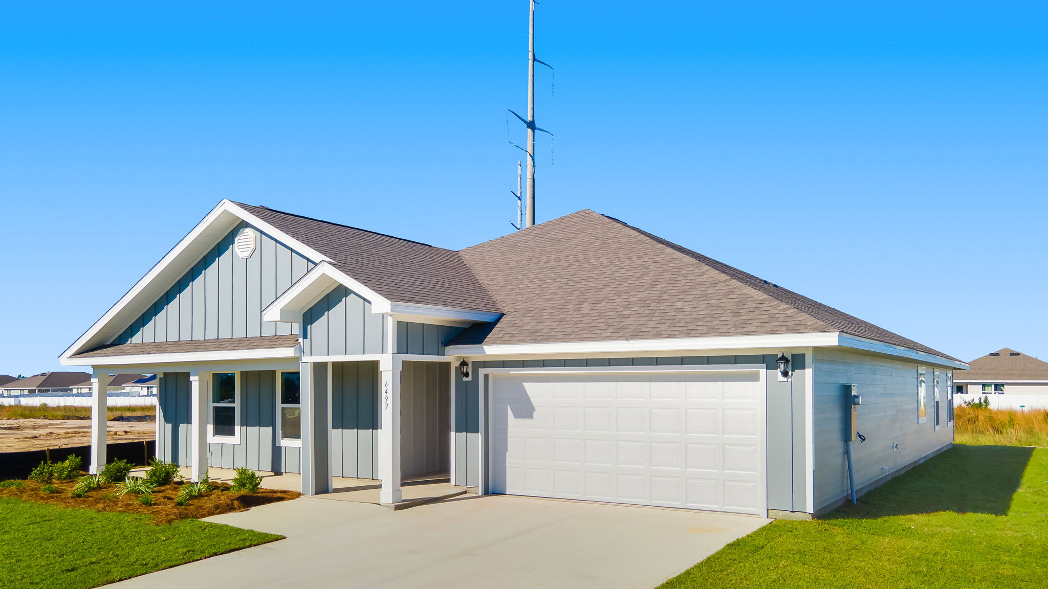 Denton floor plan at Destini Lane with Hardie Board siding and two-car garage and covered front porch.