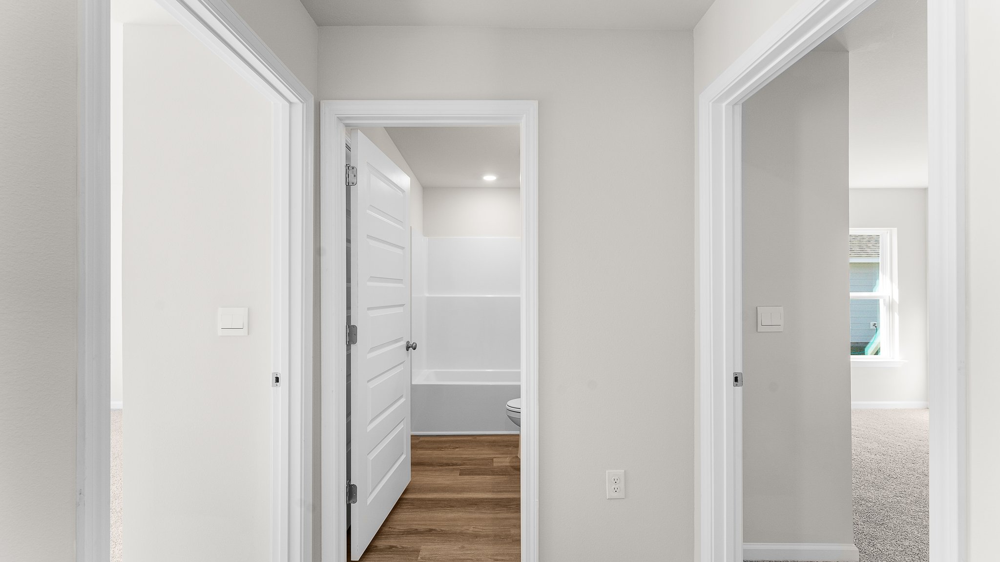 Hallway next to bedrooms and bathroom.