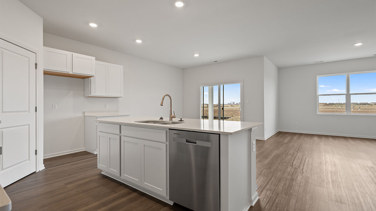 Kitchen island with a view of dining room and living area.