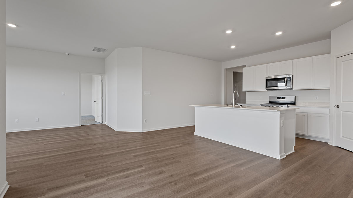 Dining area viewing the kitchen and living area.