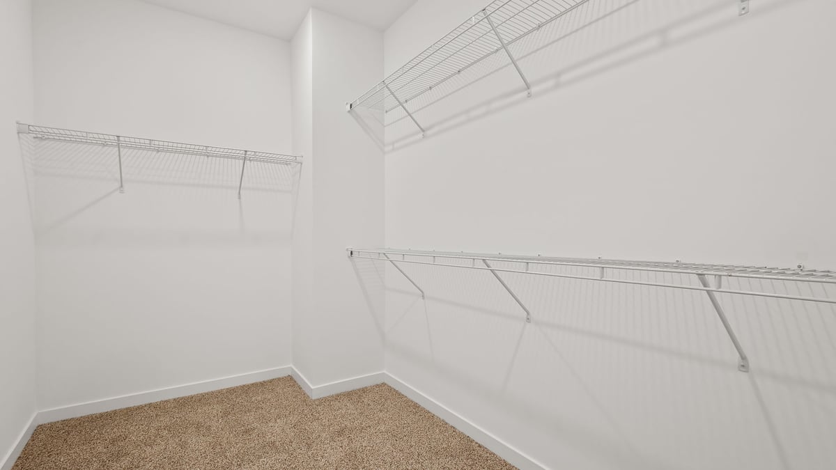 Primary walk-in closet.