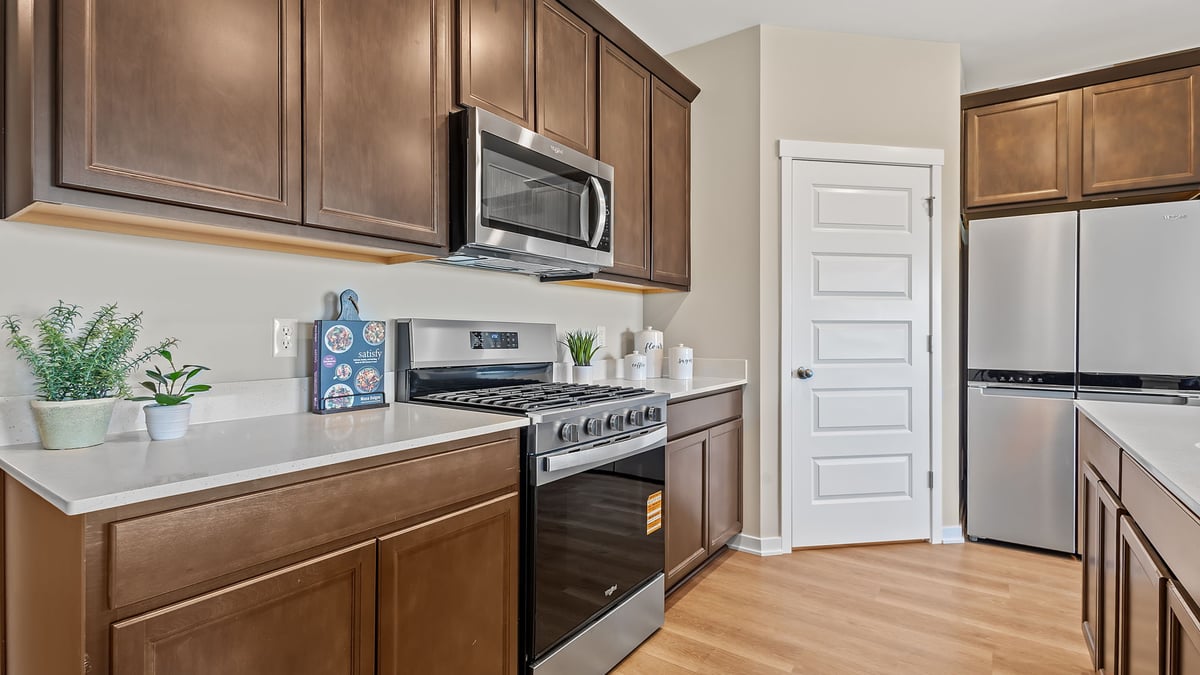 Kitchen with flagstone cabinetry and appliances.