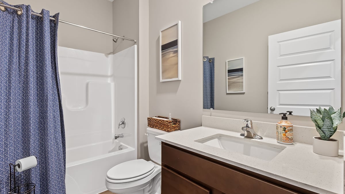 Bathroom with one vanity sink and a shower.