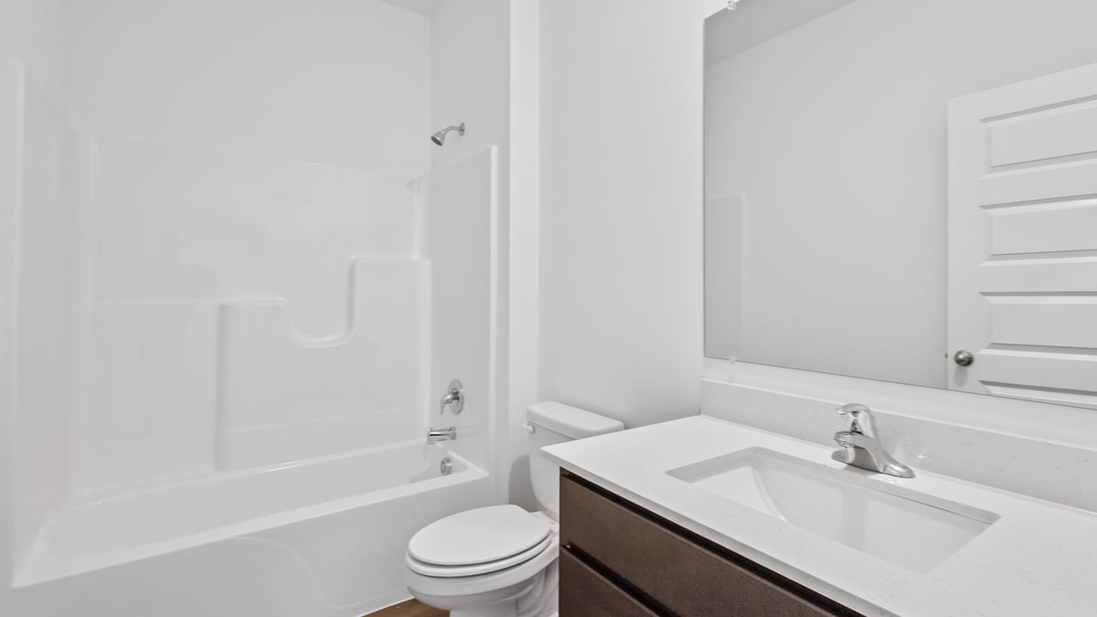 Bathroom with one vanity sink and a shower.