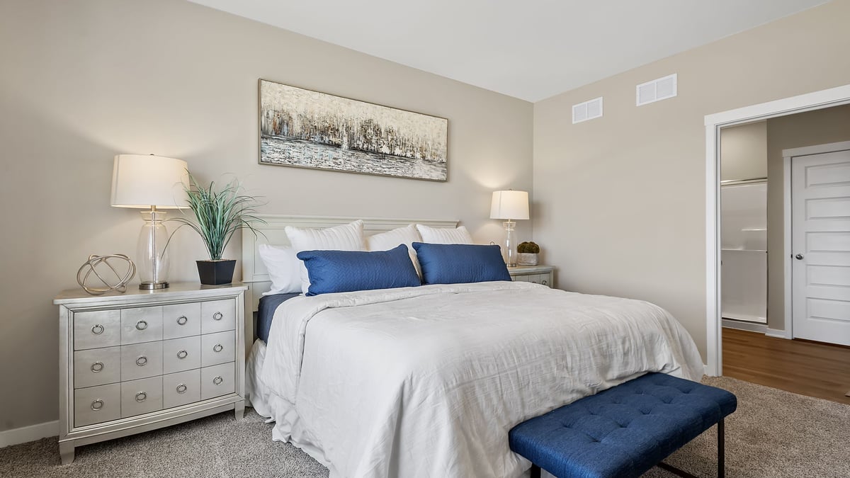 Primary bedroom with carpeted floors and great space.