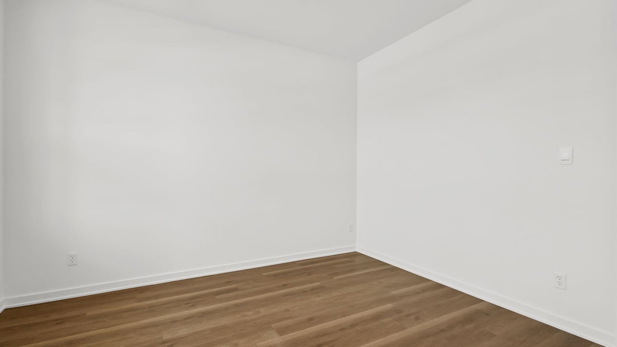 Front room with hard wood flooring.