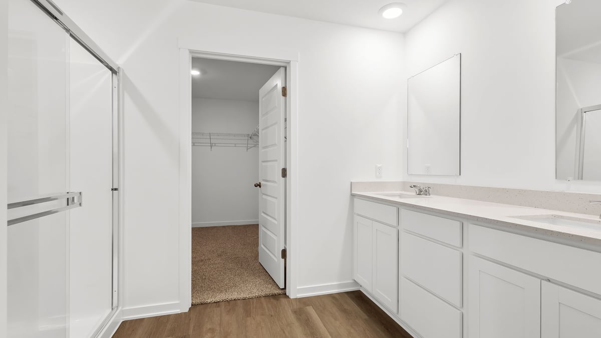 Dual vanity sink with walk in shower