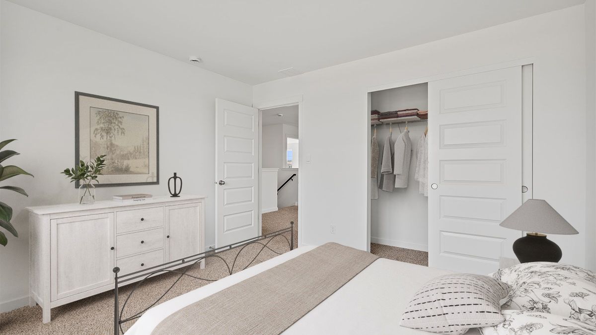Bedroom with carpeted floors with a closet.