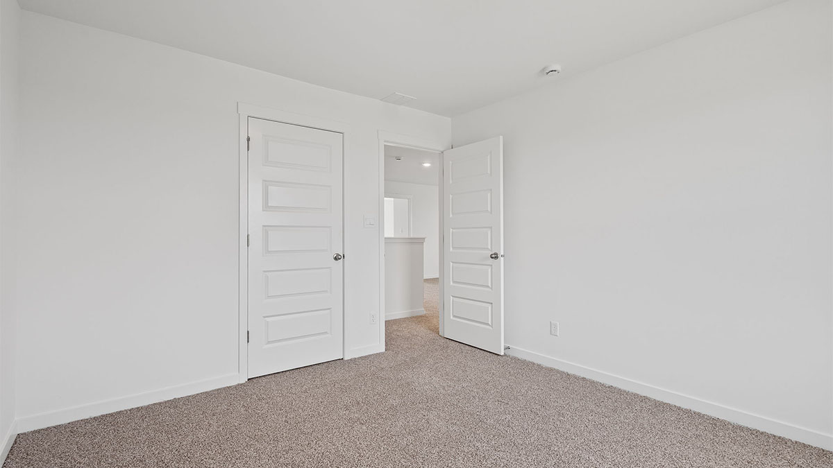 Bedroom with carpeted floors and space.