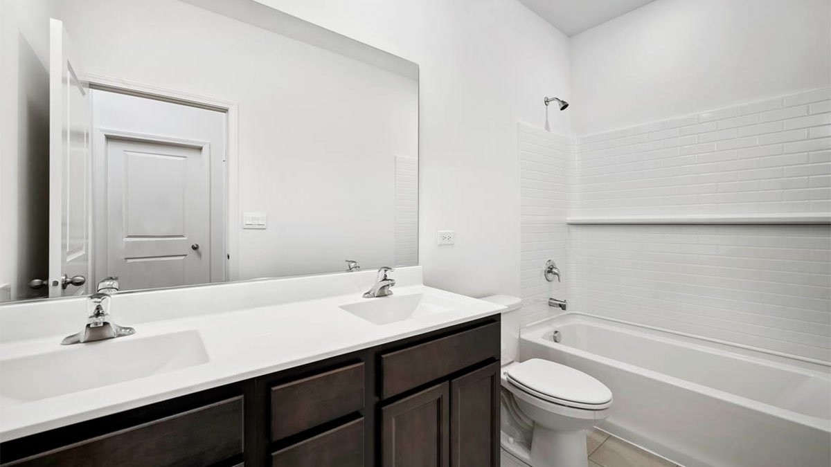 Dual vanity sinks with a shower.