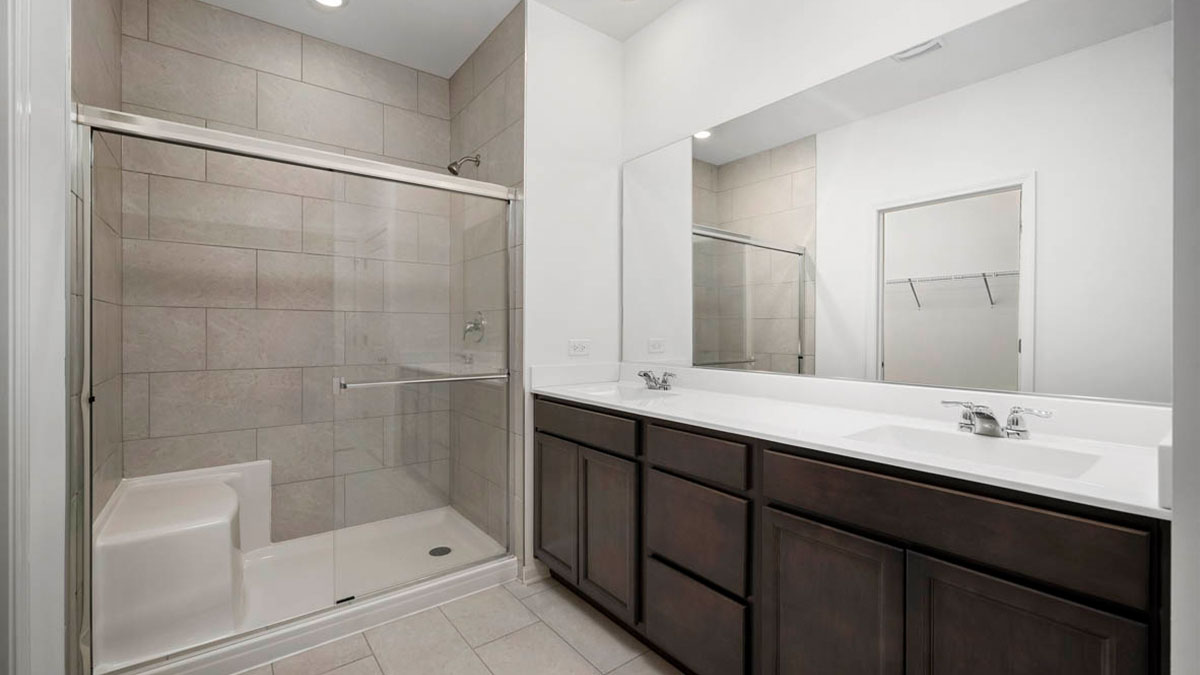 Dual vanity sinks with walk in shower.