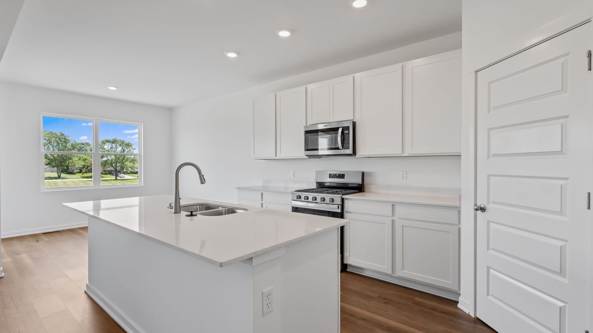 Kitchen with white cabinets and stainless steel appliances