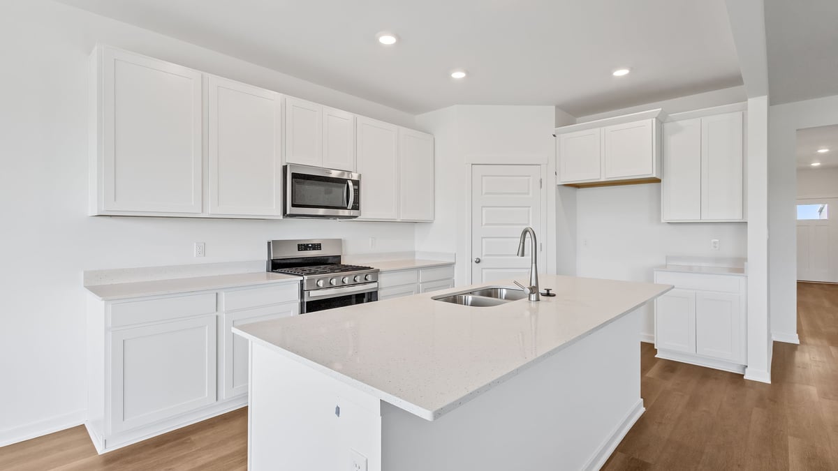Kitchen with white cabinets and stainless steel appliances
