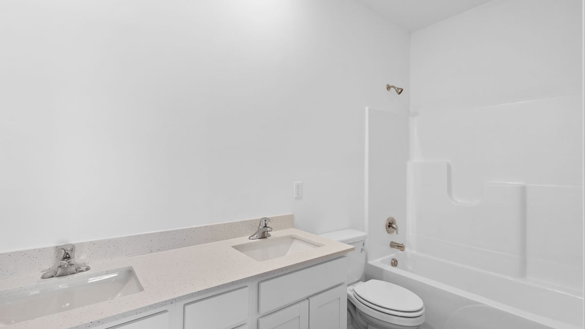 Dual vanity sink and shower.