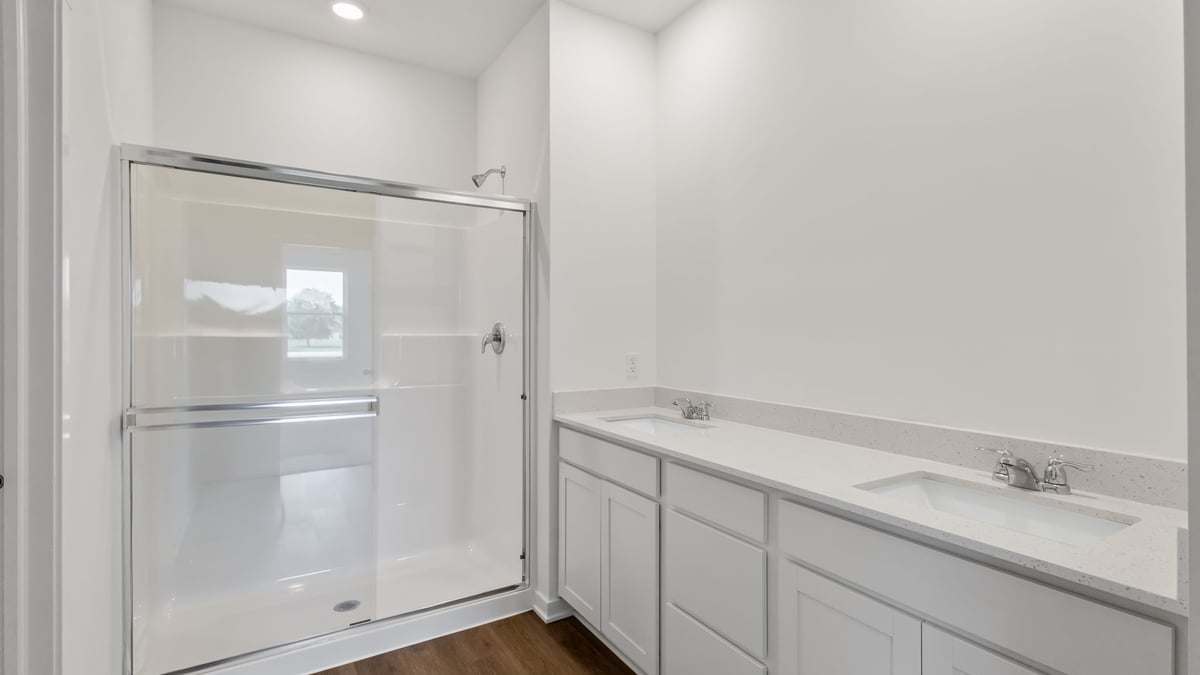 Dual vanity sinks and walk in closets.