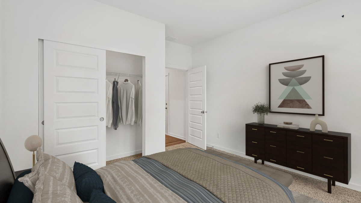 Bedroom with a closet and carpeted floors.