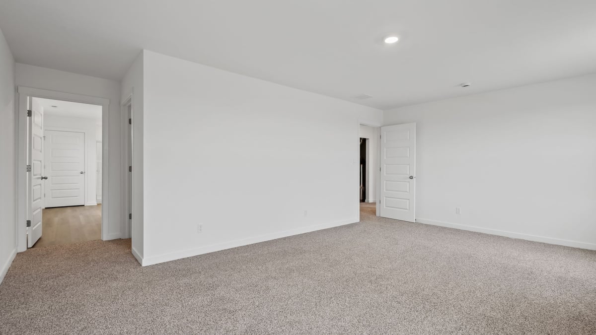 Loft room and carpeted floors.