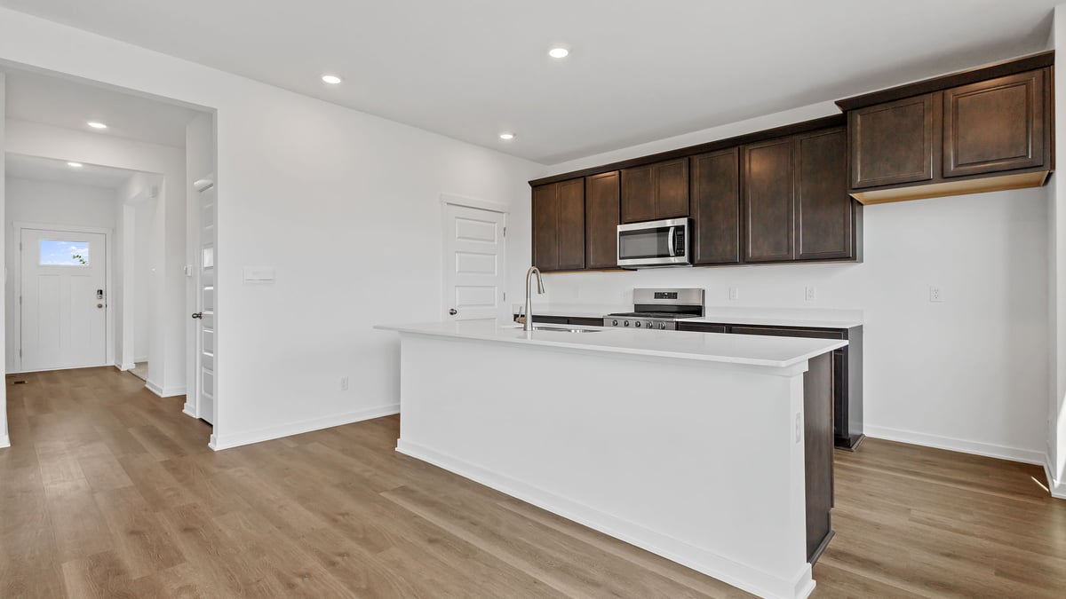 Kitchen with flagstone cabinetry with hard wood floors.
