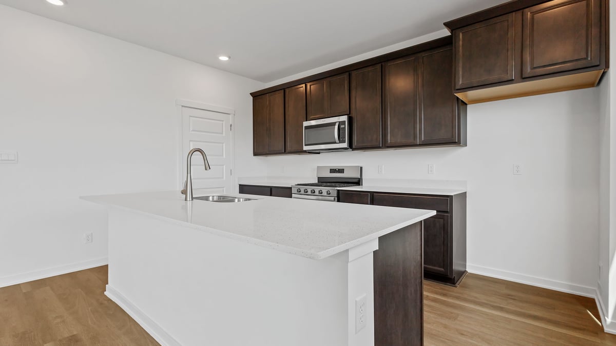 Kitchen with quartz countertops and great space.