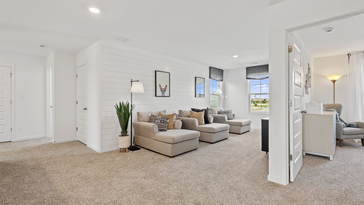 Loft area with carpet.