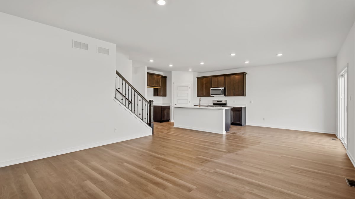 Living room area with hard wood flooring.