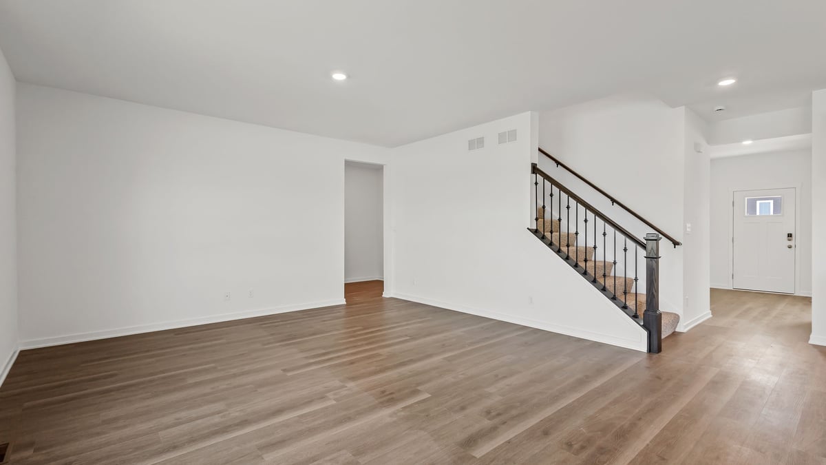 Living room area with hard wood flooring.