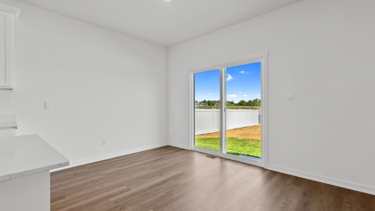 Dining area with sliding glass door.