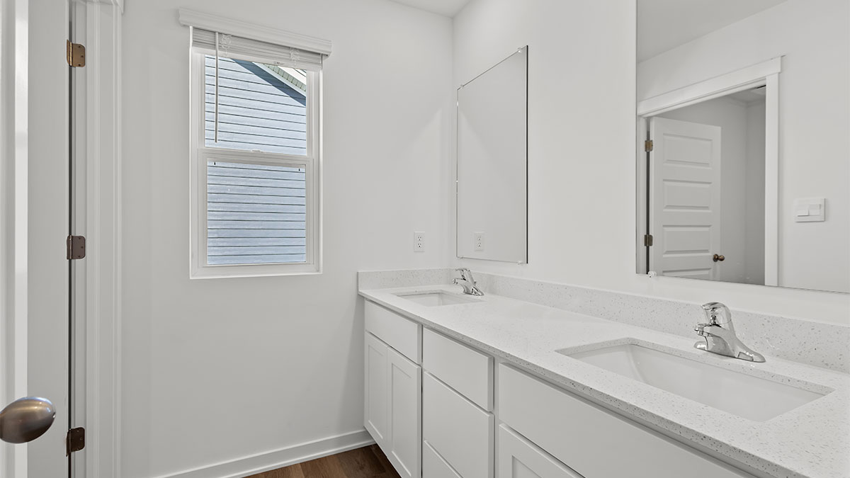 Dual vanity shower with window and shower.