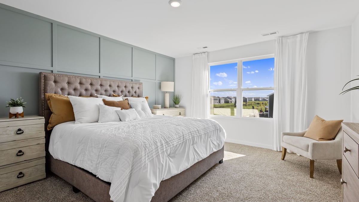 Primary bedroom with a big window and great space.