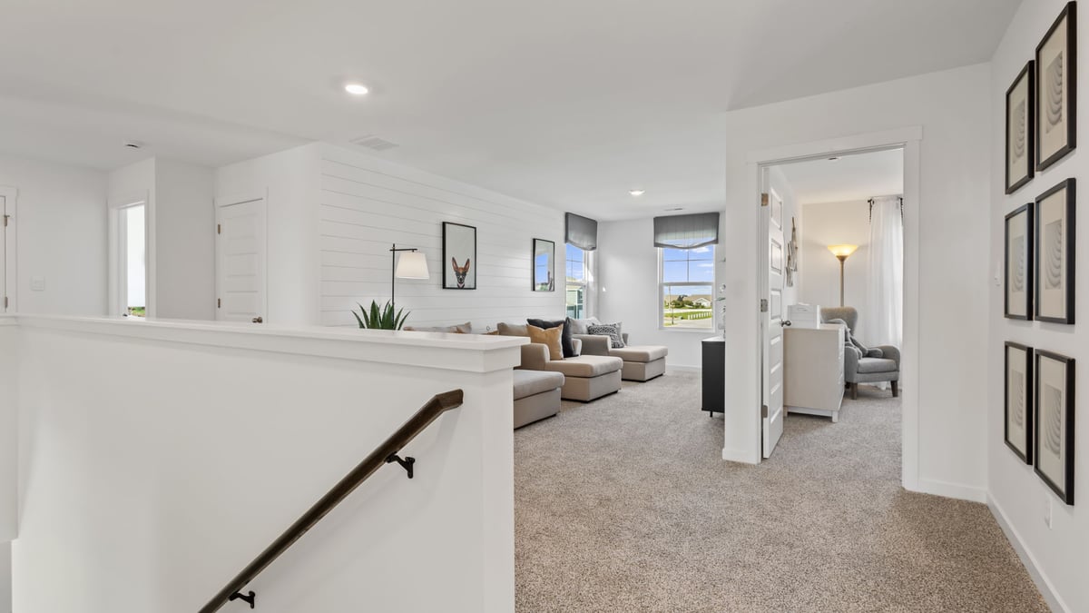 Upstairs area with carpeted floors.