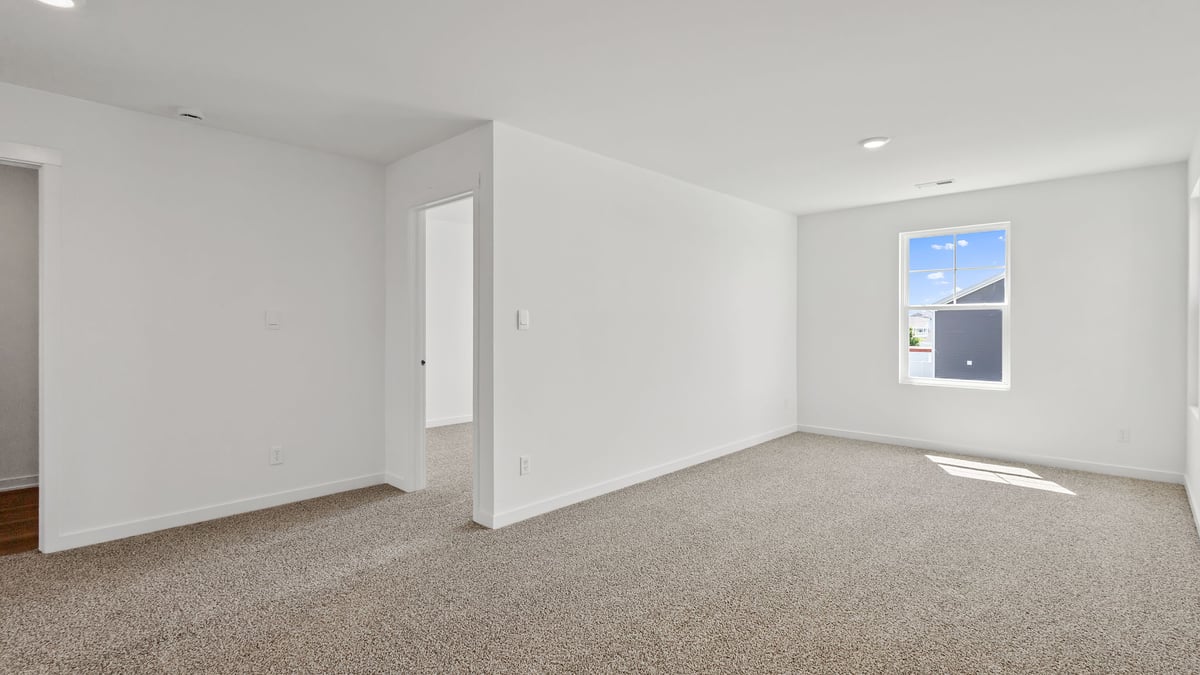 Loft area with great space and carpeted floors.