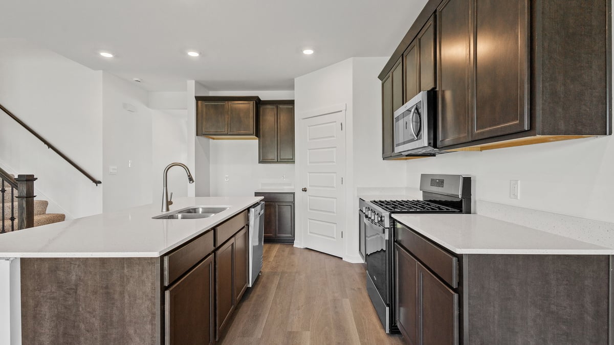 Kitchen with flagstone cabinetry and hard wood flooring.