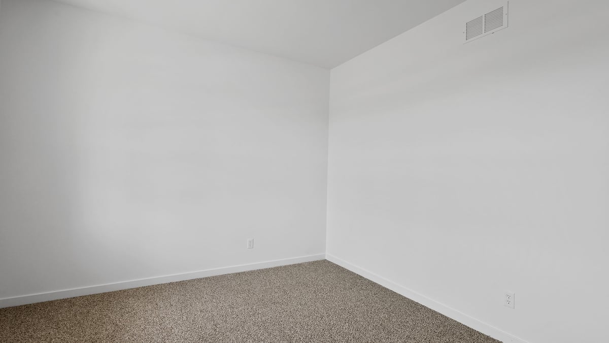 Front room with carpeted floors.