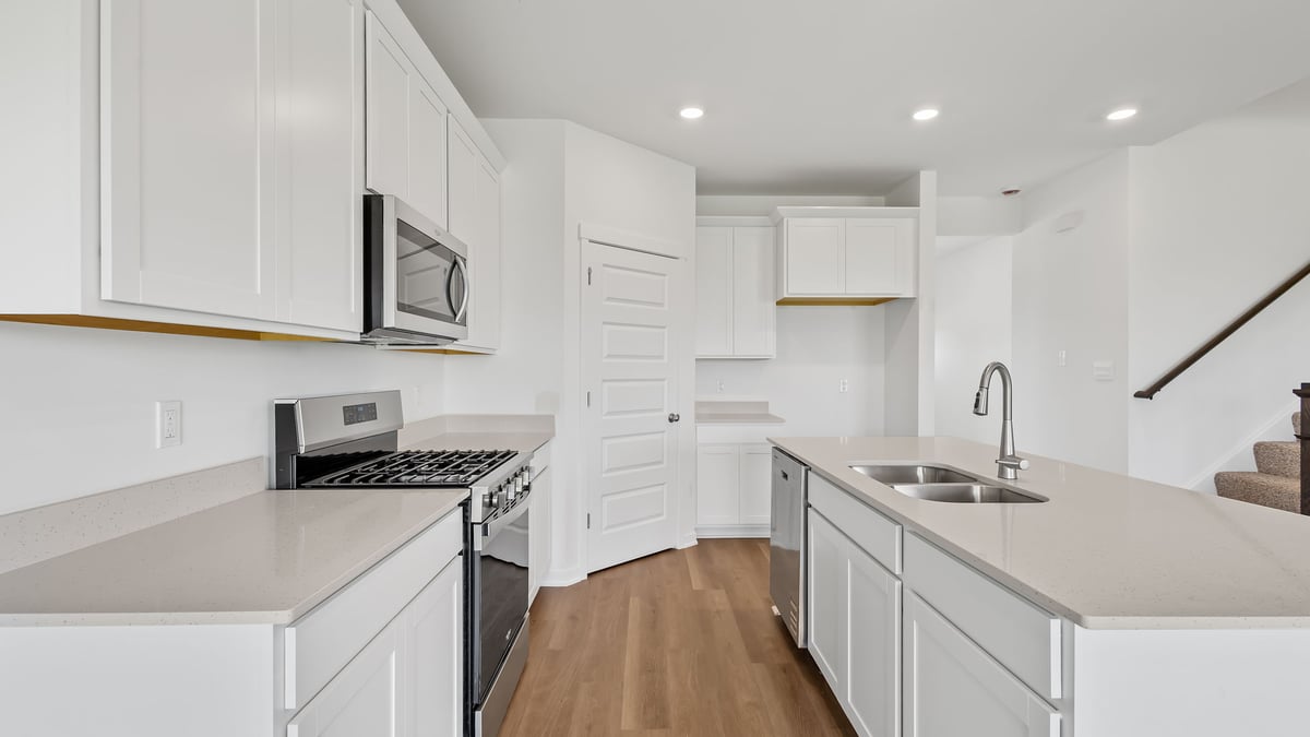 Kitchen with white cabinetry.