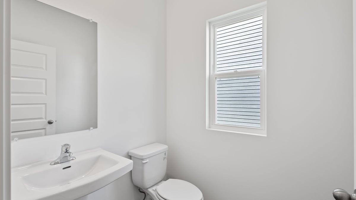 Powder room with one sink and window.