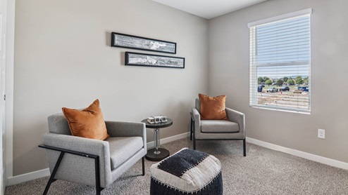 Bedroom with carpeted floors and a window.