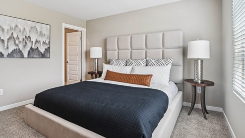 Bedroom with carpeted floors and a window.
