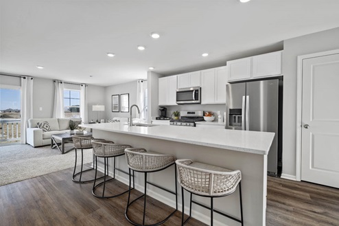 Kitchen with white cabinets and stainless steel appliances
