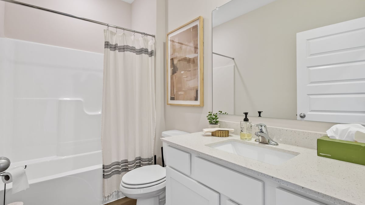 Bathroom with one vanity sink and a shower.